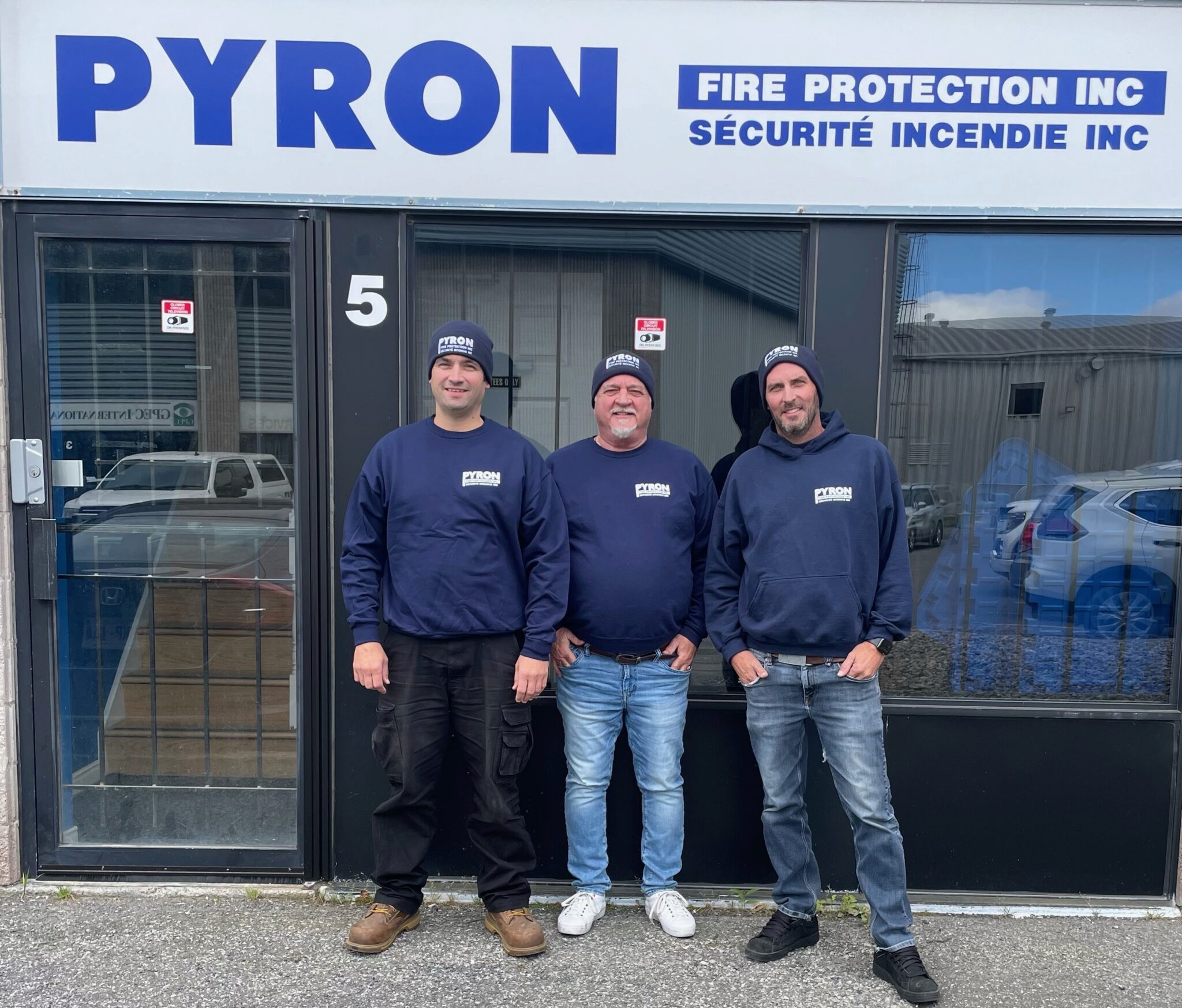 LtoR: Ryan Licari, Ron Licari and Andre Larabie stand proudly outside Pyron headquarters in Ottawa.